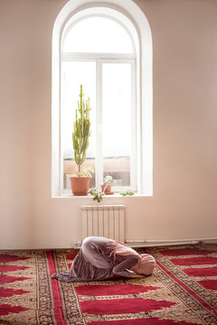 Woman praying in the mosque