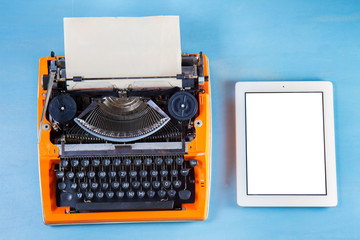 Workspace with vintage orange typewriter