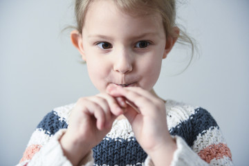 Little girl with a spoon