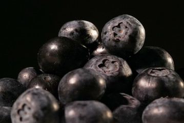Blueberries on black background close up isolated