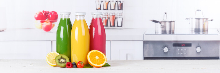 Obraz na płótnie Canvas Juice smoothie orange smoothies in kitchen copyspace banner bottle fruit fruits