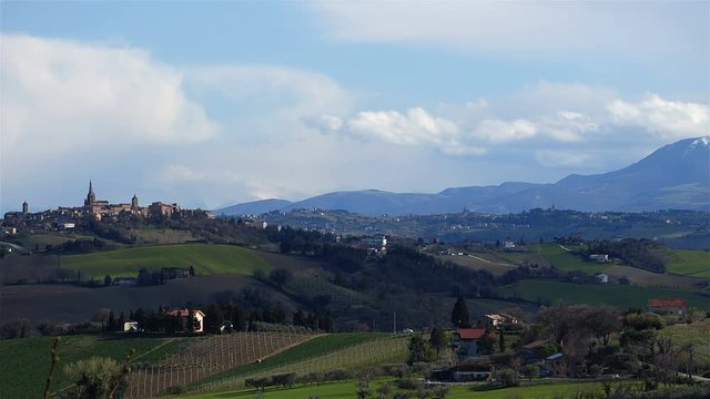 High angle time lapse shot of shadows of clouds passing over rural farmland / Corinaldo (Marches, Italy)