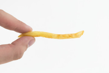 french fries in the fingers isolated on white background
