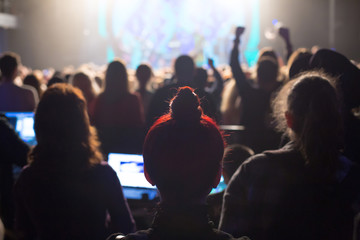 Audience watching the scene with artists.