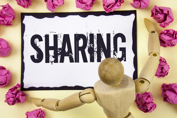 Handwriting text Sharing. Concept meaning To Share Give a portion of something to another Possess...