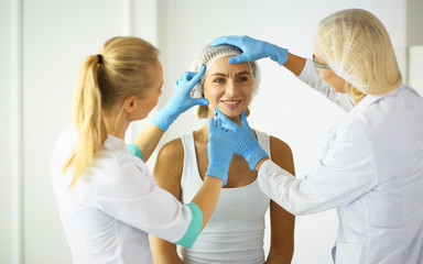 Obraz premium Permanent Makeup For Eyebrows. Beautiful Woman With Thick Brows In Beauty Salon. Beautician Doing Eyebrow Tattooing For Female Face. Beauty Procedure