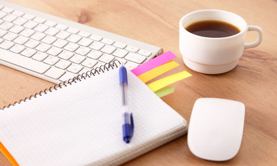 Workplace with notebook laptop Comfortable work table in office windows and city view