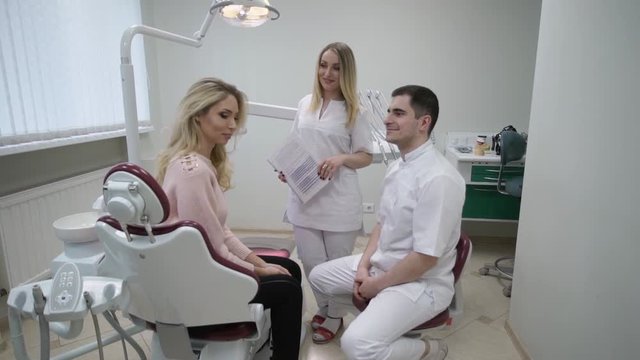 Dentist doctor with patient at consultation talking
