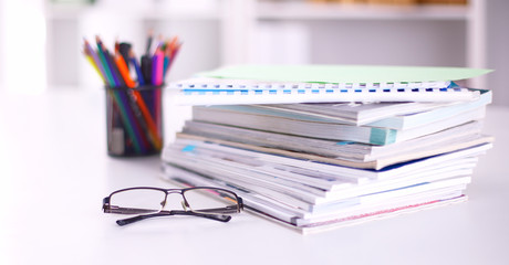 Workplace with notebook laptop Comfortable work table in office windows and city view