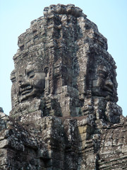 Fototapeta na wymiar Faces of the Bayon temple in the Angkor Wat complex, Siem Reap, Cambodia