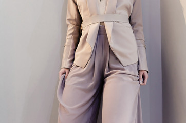 business beige jacket and wide-leg pants