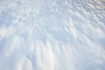 Wind patterns in snow and sunlight