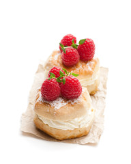 Traditional  scones with raspberry and cream isolated on white