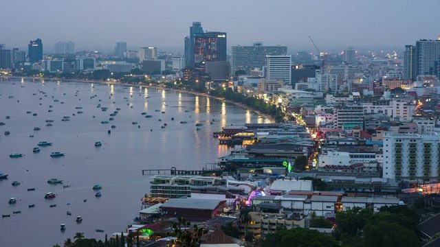 day to night timelapse of Pattaya city and the many boats docking