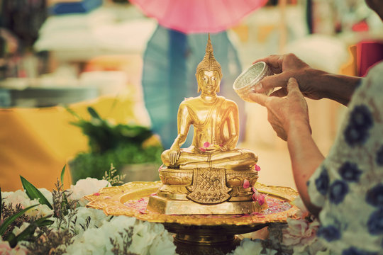 sprinkle water onto a Buddha image,  Songkran Festival 