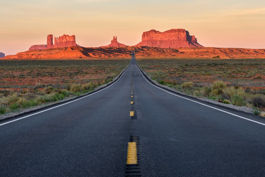 Straight Road Vanishing Into Monument Valley