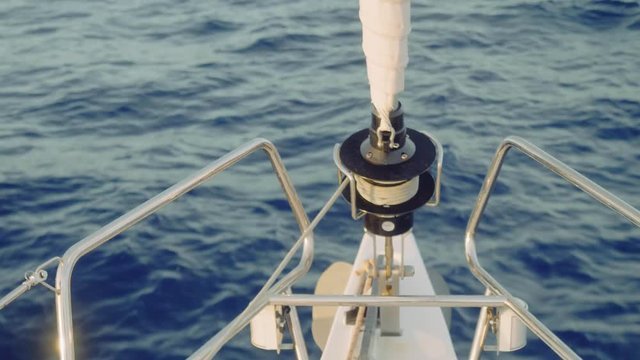 View of jib furler on board of sailing yacht.