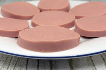 Boiled sausage slices isolated on white background. Collection