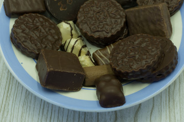 Chocolate Balls on wooden background .