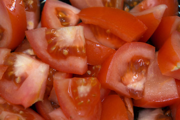 Freshness cut tomato from japanese on wooden plate .