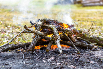 Summer campfire on camp site