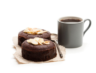 Chocolate  fondant with almonds and cup of coffee isolated on white