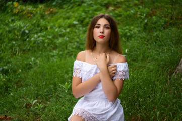 Naklejka na ściany i meble Beautiful model in a white summer dress