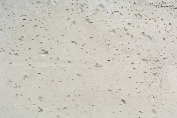 Texture of concrete. Porous concrete background. Concrete background with bubbles. Uneven concrete surface background.