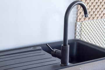 Modern kitchen and bathroom water faucets in the store