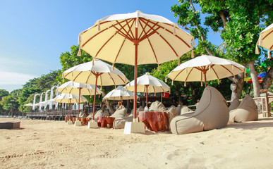 Many bean bags outdoor on the sand beach with ocean view