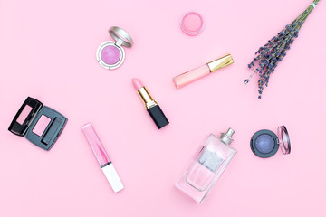 Set of cosmetics on a pink background. Pastel color