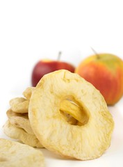 A close up of dried apple rings in a white background with copy space for your text