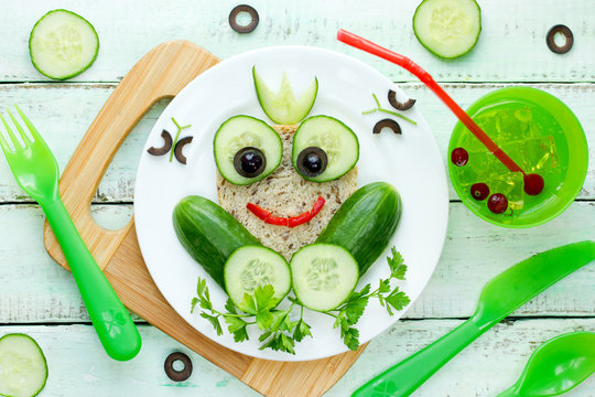 Healthy sandwich for kids, frog sandwich from whole wheat bread and cucumber