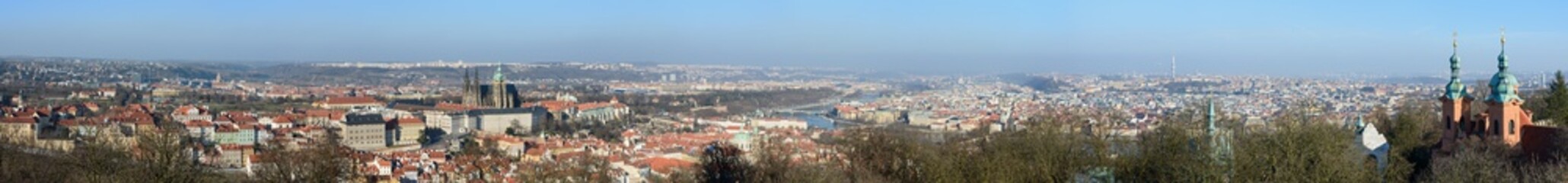 Fototapeta premium Panorama of Prague in sunlight of winter afternoon, Czech Republic.