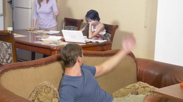 the girl is present in the parental quarrel. father and mother swear. the daughter ignores the conflict between the parents. 4k