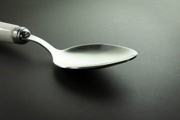 Fork or spoon in black background luxury style