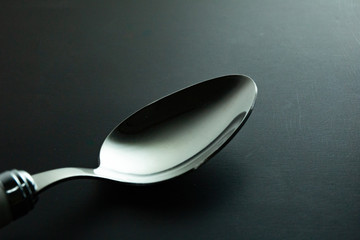 Fork or spoon in black background luxury style