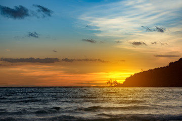 Fototapeta premium Sunset at the Lazy. Waves are breaking on the shore. Tropical Island, Koh Rong Sanloem. Cambodia, asia. 