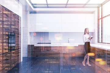 Blonde woman in a loft kitchen