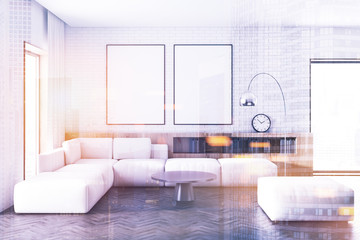 White brick living room, white sofa, posters toned
