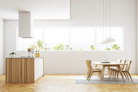 White kitchen and dining room interior side view