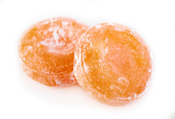 Colored round candy in powdered sugar. Bright candy.