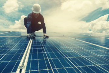 engineer team working on replacement solar panel in solar power plant;engineer and electrician team...