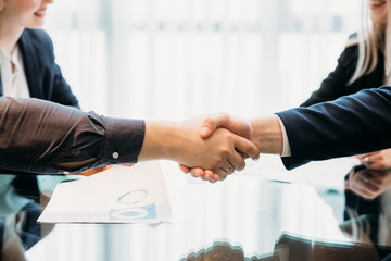 closing or sealing a deal. business partners shaking hands. cooperation partnership, trust joint venture concept - obrazy, fototapety, plakaty
