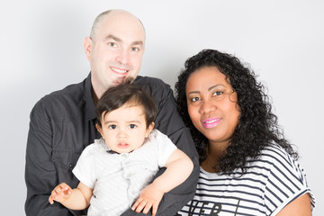 Fototapeta na wymiar black Mother and father Happy multiethnic family with children son and looking at camera