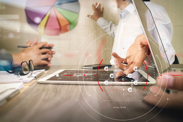 Businessman making presentation with his colleagues and business strategy digital layer effect at the office as concept