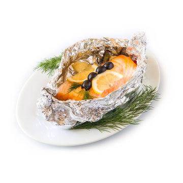 Fish red baked in foil on a white plate. Isolated