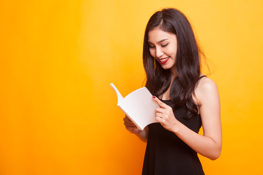 Young Asian woman with a book.