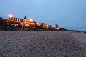 Public beach by the Baltic Sea in Mielno with evening illuminations