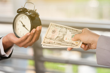 Unidentified business people use dollar bank note buy the time from other people, business concept...